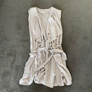 Sleeveless belted duster coat